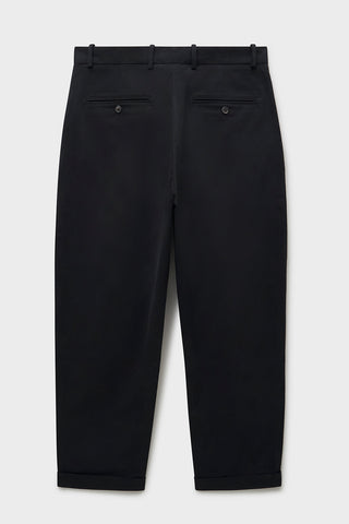 Organic Cotton Stretch Black Pleated Trouser with Button Fastening. Sustaianably made with Sondrio Italian material which uses 90% of its energy on-site, with 83% of its waste being recovered for reuse.  