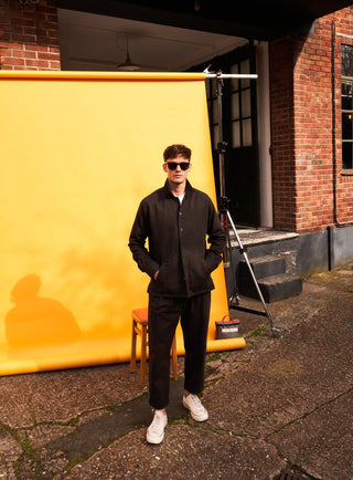 Chocolate Bomber Trousers/ Chinos tailored from a robust cotton twill with a button fastening.  They are a rich brown twill woven in Italy with 60% recycled cotton.