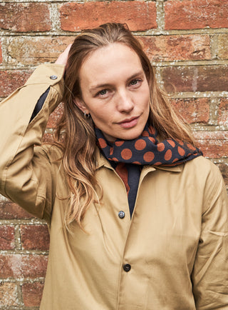 100% Recycled Double Faced Wool Burnt Orange Navy Spot Classic Scarf on one side, thick stripe on the other side.